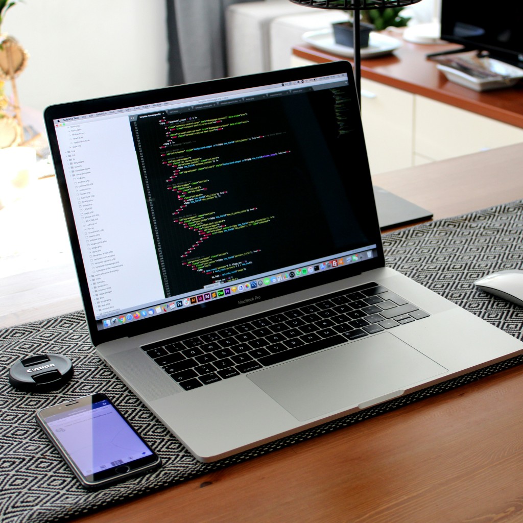 Website development on a MacBook with code editor
